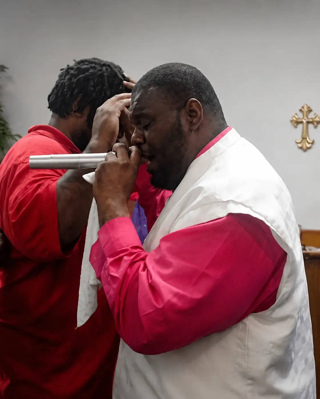 Prayer and anointing during a ministry service